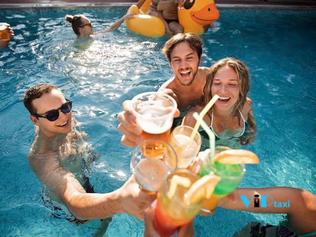 Friends Enjoying Drinks in the Best Pool Parties in Scottsdale