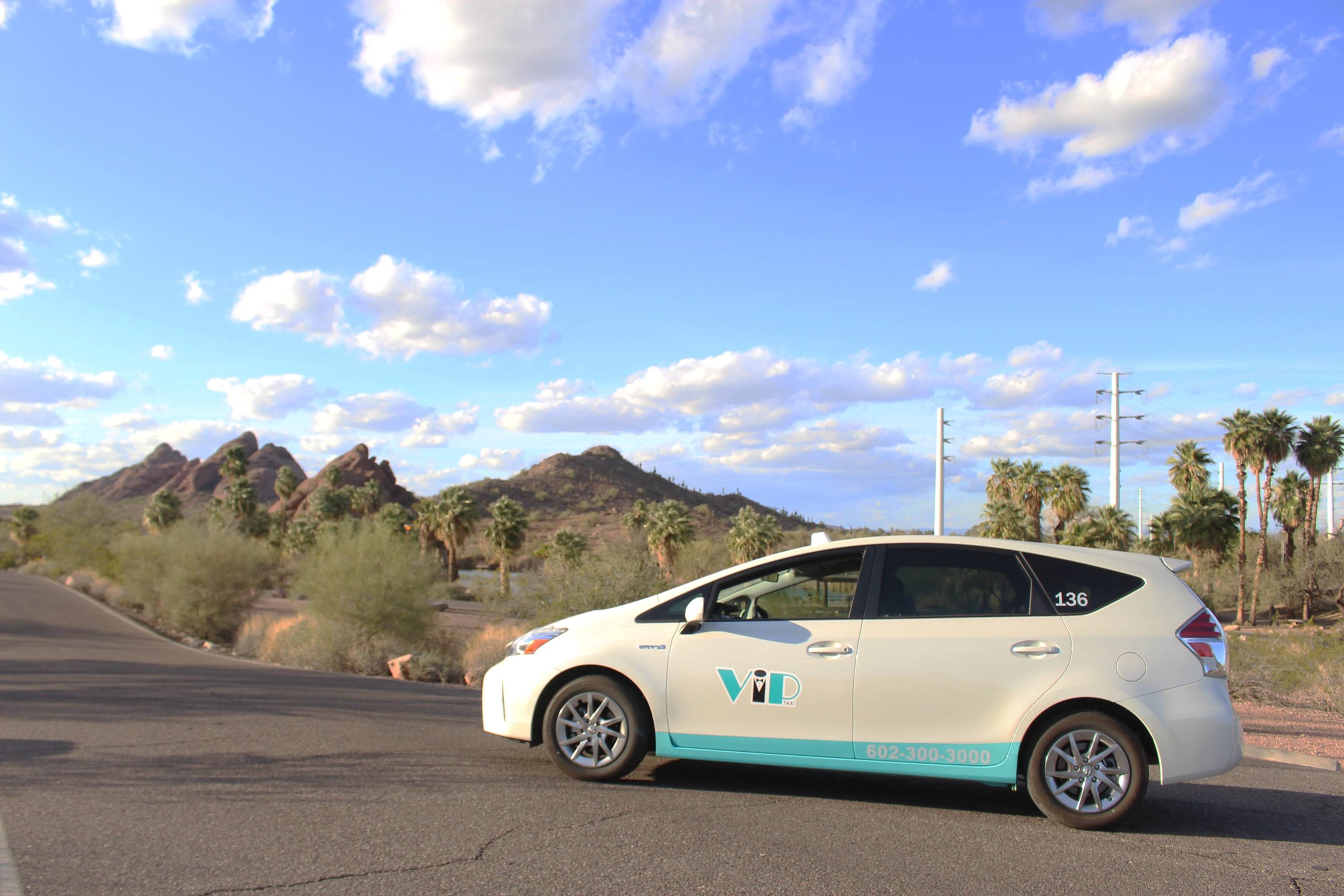 VIP Taxi Car on Road Near Arizona Mountains