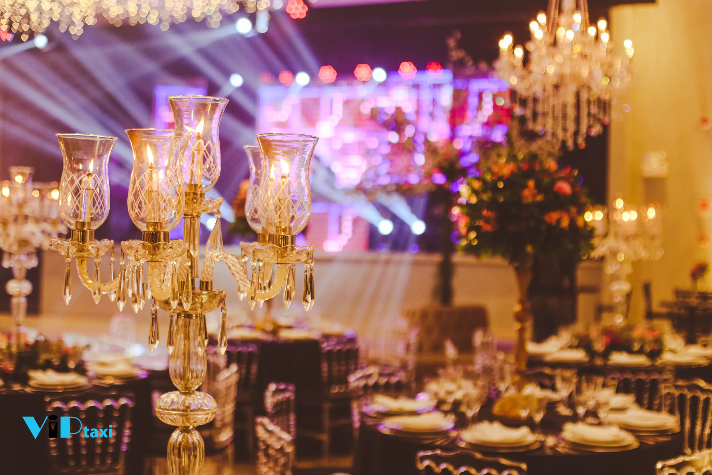 elegant-event-tables-crystal-candelabras-stage-lights Elegant Event Tables with Crystal Candelabras and Stage Lights